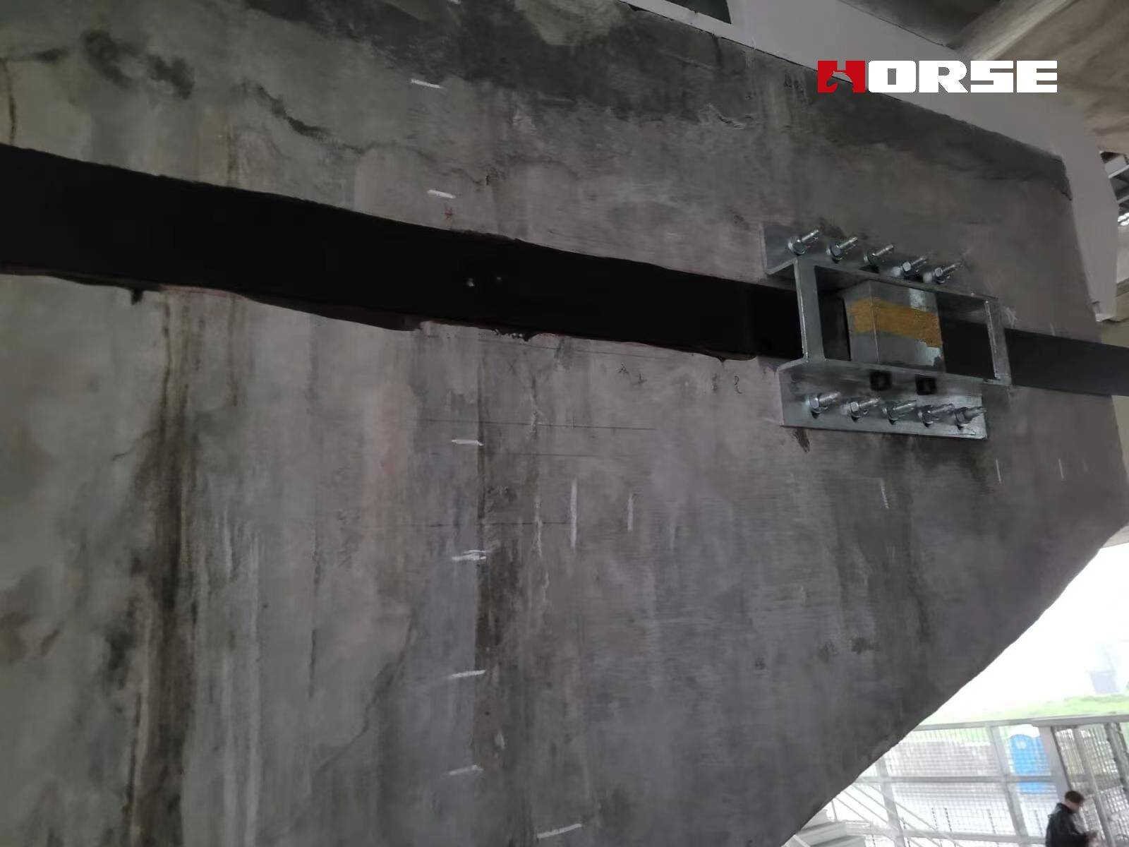 Strengthening of Bridge Structures with post tensioned CFRP plates